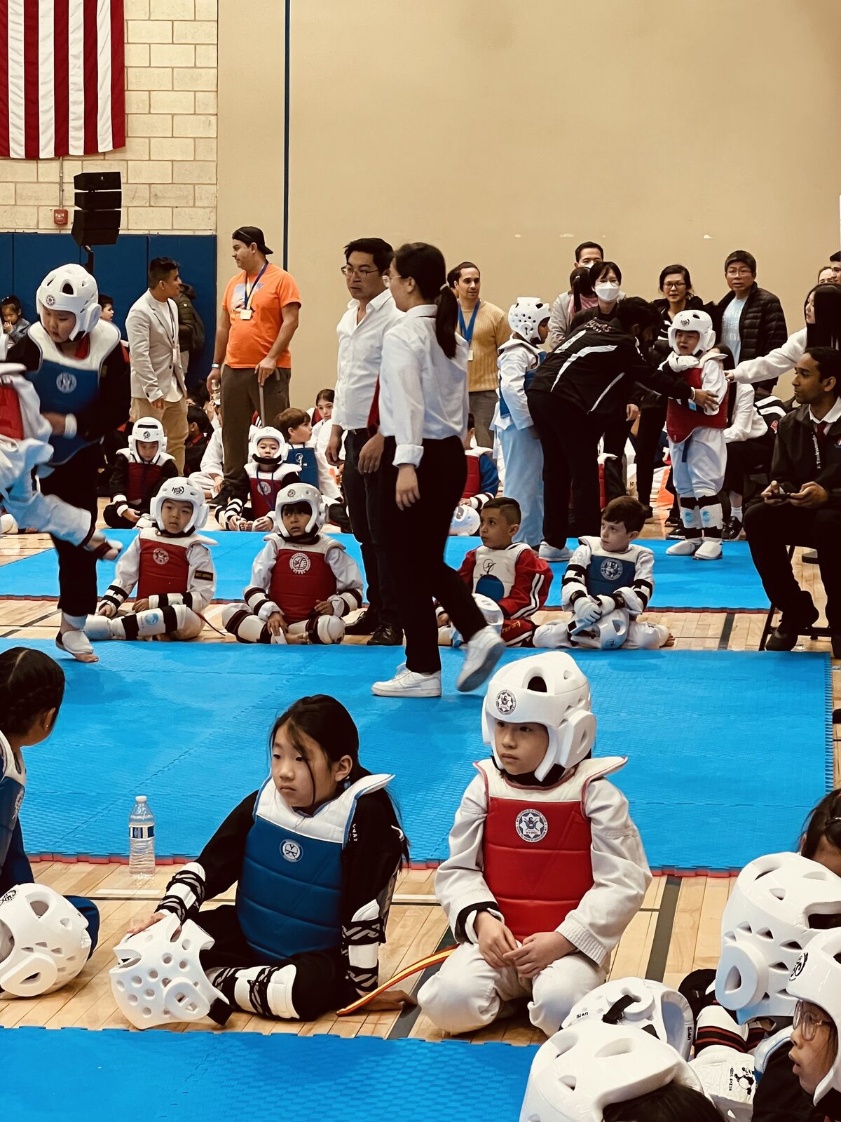 Competitors waiting on the mats before their matches