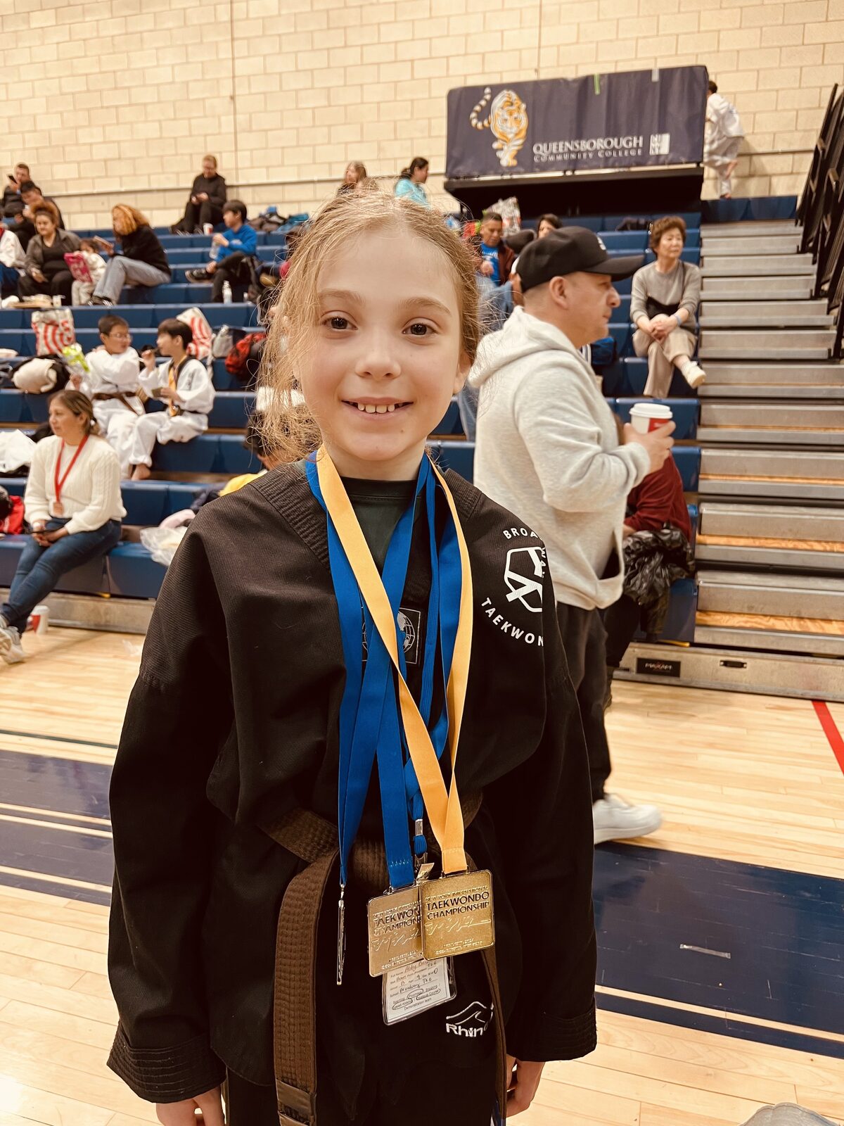 A competitor smiling at a Taekwondo tournament