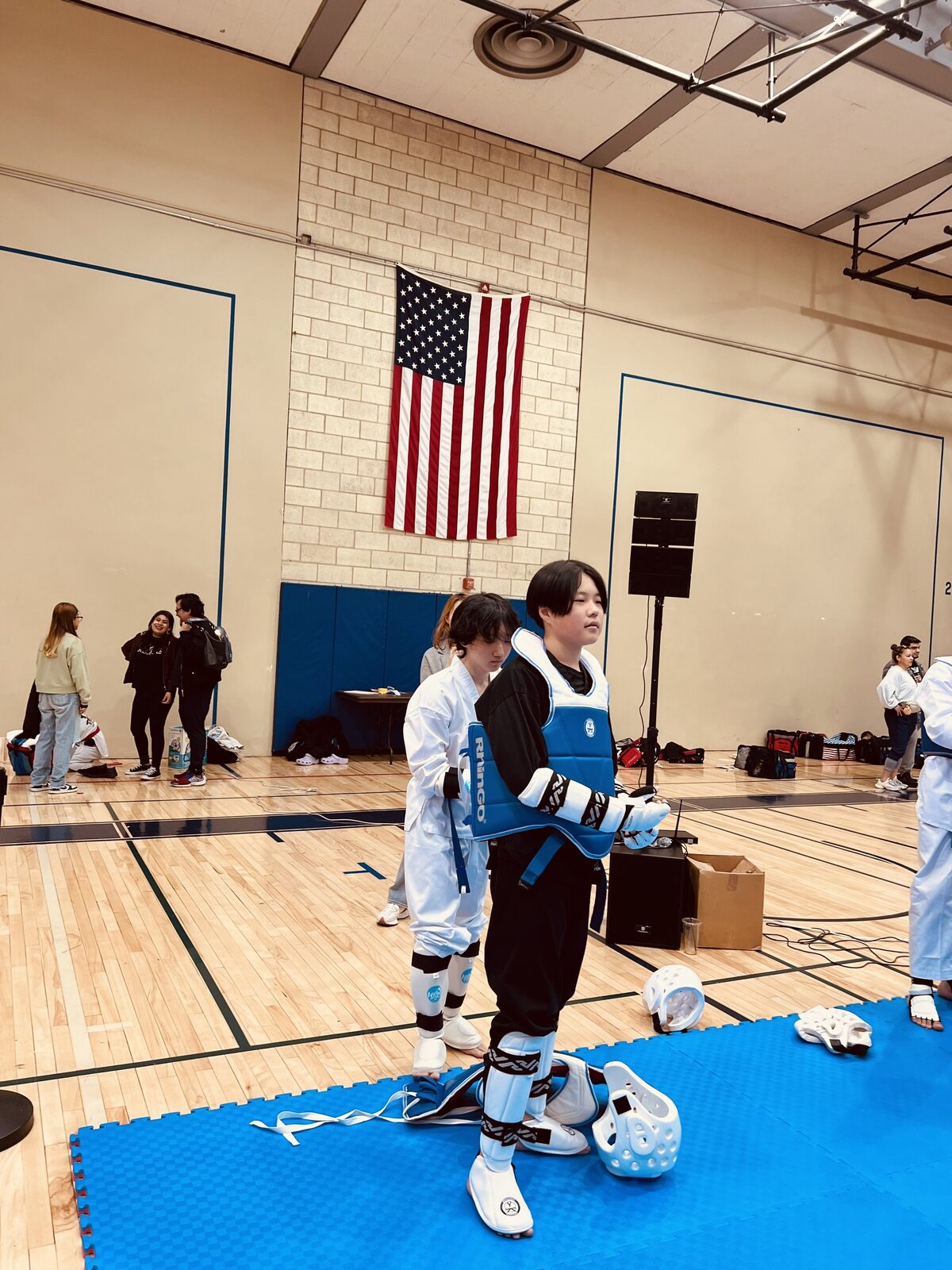 A student preparing for a sparring match