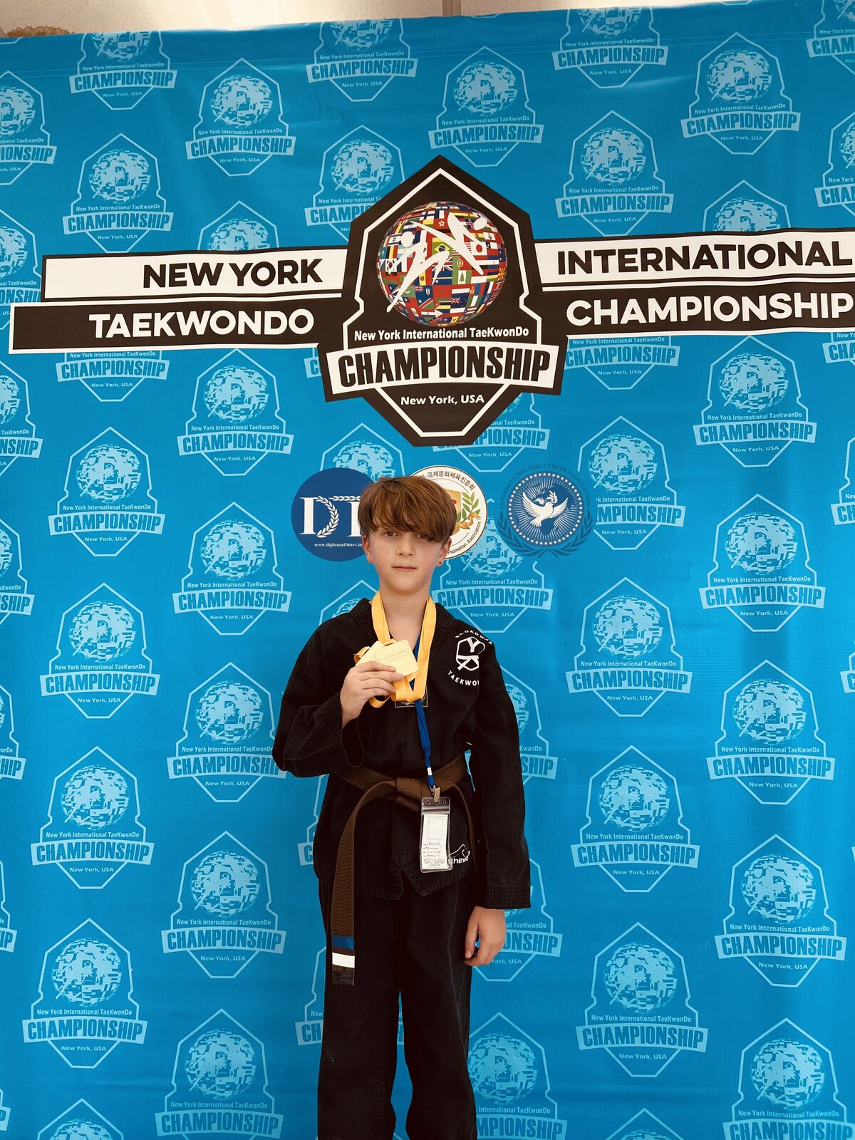 A student with a gold medal after competing