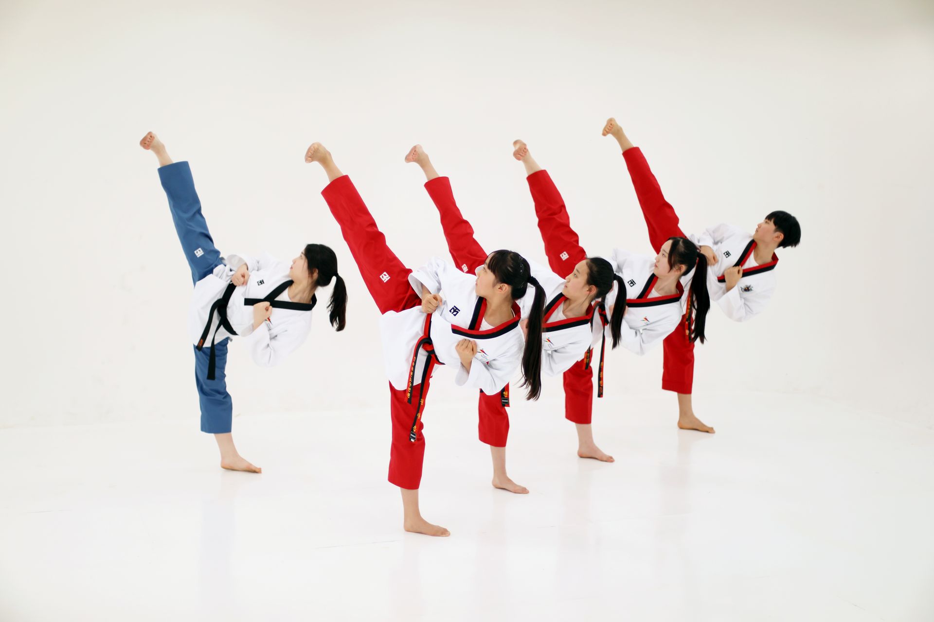 Adult Taekwondo students training together